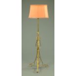 A late 19th century brass lamp standard, in the Arts & Crafts style,