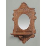 A 19th century carved oak hall mirror,