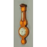 An Edwardian style mahogany cased aneroid barometer, with alcohol thermometer. Height 69 cm.