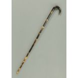 A 19th century turned horn cane, sectional. Length 84 cm.