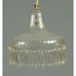 A cut glass light fitting, with faceted droppers.