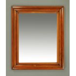 A Victorian rosewood framed mirror, with cushioned frame to bevelled mirror.