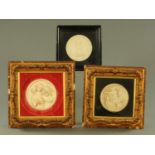 A pair of composition relief moulded plaques, after engravings by EW Wyon,