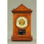 An Edwardian inlaid mahogany mantle clock, with eight day movement striking on a gong, 35.5 cm high.
