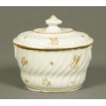An English porcelain sucrier and cover, fluted form, decorated with gilt sprigs. 14 cm.