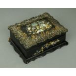 A Victorian papier mache jewellery and watch case, inlaid with mother of pearl. Length 18 cm.