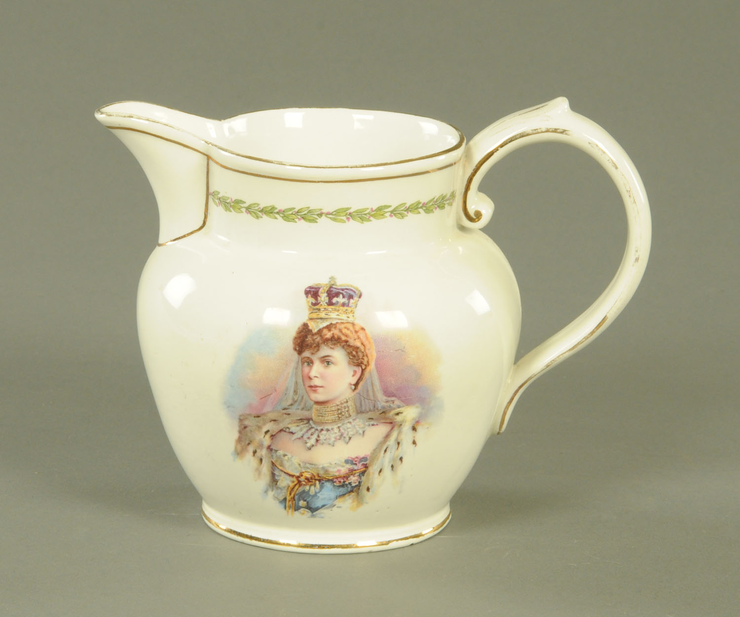 A George V milk jug, transfer printed with Princess Mary. Height 14.5 cm.