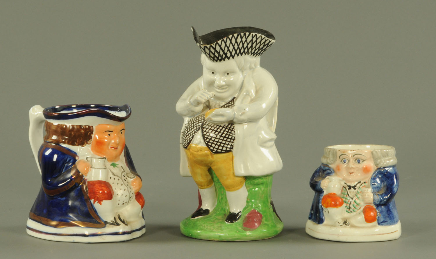 A Staffordshire pearl ware figure "The Snuff Taker",