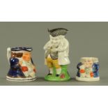 A Staffordshire pearl ware figure "The Snuff Taker",