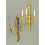 A pair of gilt metal three branch wall light fittings. Height 69 cm, width 37 cm.