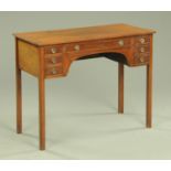 An Edwardian mahogany dressing table, with kneehole recess,