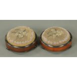 A pair of Victorian mahogany circular footstools, with beadwork tops and ebony line inlay.