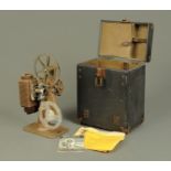 A revere 8 mm cine projector, in case and with original receipt dated 1942.