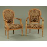 A pair of French style part painted walnut framed armchairs, with upholstered backs,