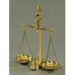 A set of polished brass Librasco balance scales and weights. 55 cm high (see illustration).