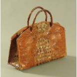An early 20th century reptile skin handbag, 32.5 cm wide.