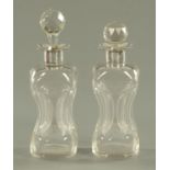 A pair of Edwardian silver mounted and dimple glass decanters, the silver Birmingham 1909,