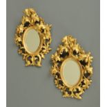 A small pair of 19th century Florentine gilt wood framed mirrors. Height 33 cm x 23 cm.