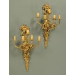 A large pair of brass five branch light fittings, in the Classical style, with bellflower swags.