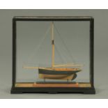 A scale model of the yacht "Foam", by W Malcolm Wilson 2010 in glazed case.