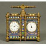 A brass desk timepiece and barometer, with champleve type enamel decoration. Width 128 mm.