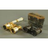 A pair of gilt metal and mother of pearl opera glasses, with telescopic handle,