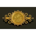 George III - gold sovereign 1817, in gold coloured metal brooch mount, F.