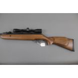 SMK Model 19 Cal 22 break barrel air rifle, with SMK 4 x 32 telescopic sight. Serial No. 0600597.