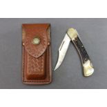 Puma Earl folding knife model 210 900, with a 3" blade and stag antler handle with leather sheath.