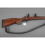 BSA bolt action Cal 22-250 rifle, 21" barrel, with 30 mm rings and leather sling. Serial No.