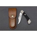Puma Sergeant folding knife model 230 265, with 3 1/4" blade with a Whitby Knives leather sheath.