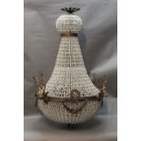 A ceiling hanging light fitting, decorated with swags and stags heads. Length +/- 94 cm.