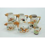 5 jugs and teapot with fox design