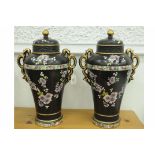 Pair of black and floral lidded vases (one marked to base "Nanking")