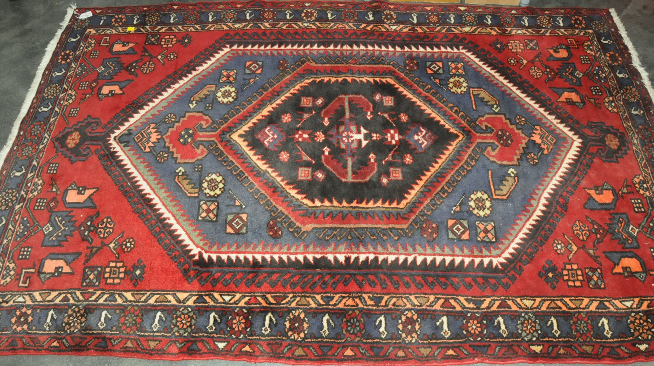 Red and blue patterned rectangular rug,