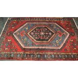 Red and blue patterned rectangular rug,