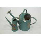 2 painted watering cans