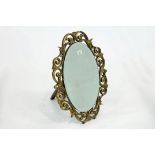 Oval mirror in ornate gilt frame