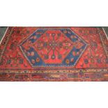 Red and blue patterned rectangular rug,