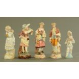 A pair of Austrian slip moulded pottery figures,
