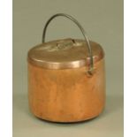 A 19th century copper cheese kettle, with lid and iron loop handle. Diameter 40 cm.