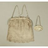 An early 20th century mesh purse, together with a silver sherry decanter label.