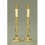 A pair of polished brass candlestick table lights,