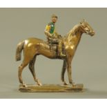 A painted bronze model of a racehorse and jockey, "Prince Roland" December 10 1931. Height 11 cm.