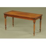 A mahogany reproduction coffee table, being boxwood strung and raised on turned and reeded legs.