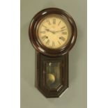A Victorian regulator wall clock, with key and pendulum, two-train. height 53 cm.
