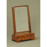 A George III walnut toilet mirror, fitted with three drawers. Width 36 cm.