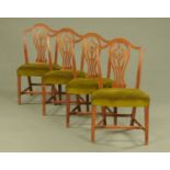 A set of four George III mahogany Hepplewhite style dining chairs,