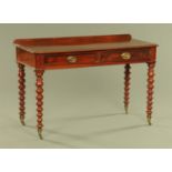 A Victorian mahogany side table, with rear upstand,