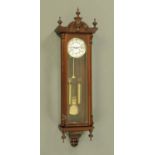 A mahogany cased Vienna style twin weight regulator wall clock,
